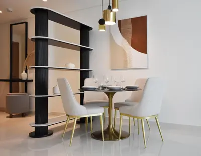 a dining room with a table and chairs at Experience Bliss 1BR Haven with Stunning Sea Views - 50AB1 in Dubai