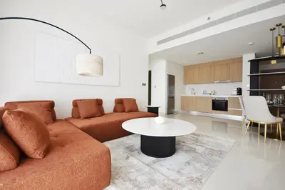 a living room with a couch and a table at Experience Bliss 1BR Haven with Stunning Sea Views - 50AB1 in Dubai
