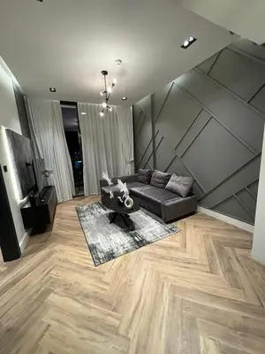 a living room with a couch and a table at Luxury 1bedrom Binghatti Avenue in Dubai