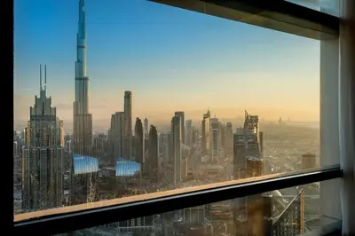 a view of a city skyline from an office window at Burj Khalifa & Downtown Views - 3BR Family Retreat Near Dubai Mall in Dubai