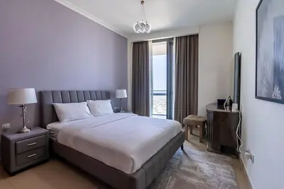 a hotel room with a bed and a television at 2BDR apartment near Burj Khalifa I Downtown Dubai I Burj Vista in Dubai