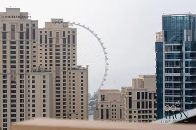 a city skyline with the london eye in the background at The Regal in Dubai