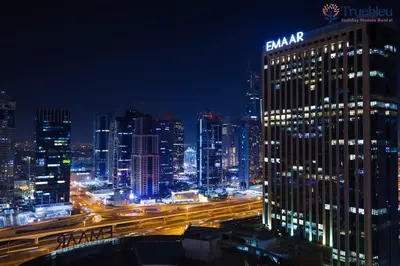 a view of a city at night with traffic at Luxury Marina View Apartment in JW Marriott Residences in Dubai