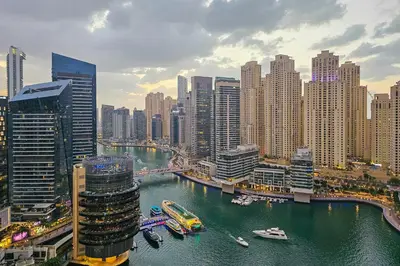 a view of a city with boats in the water at Luxury Marina View Apartment in JW Marriott Residences in Dubai