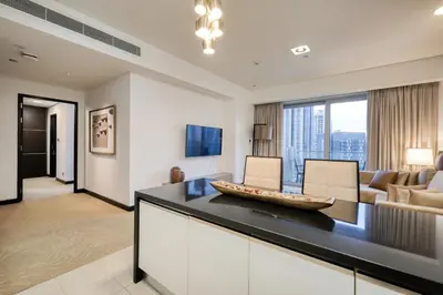 a living room with a couch and a table at Luxury Marina View Apartment in JW Marriott Residences in Dubai