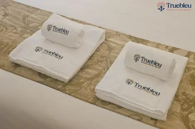 three towels sitting on a tray on a table at Luxury Marina View Apartment in JW Marriott Residences in Dubai