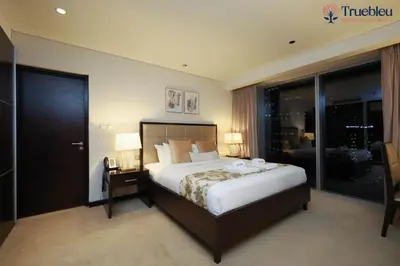 a hotel room with a bed and a window at Luxury Marina View Apartment in JW Marriott Residences in Dubai