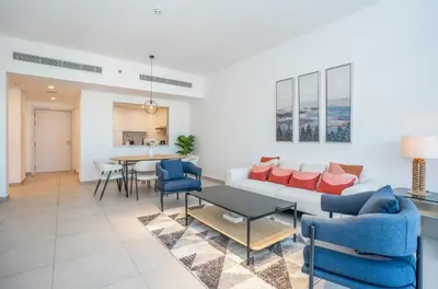 a living room with a couch and a table at Vacay Lettings 2 Bed Retreat near Burj Al Arab in Dubai