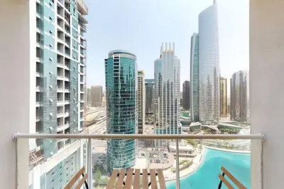 a balcony with a view of a city with tall buildings at Shiny & Fresh - Studio with Lake View - JLT in Dubai