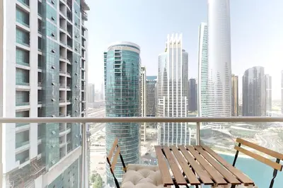 a balcony with a view of a city with buildings at Earthy & Sharp - Studio with Lake View - JLT in Dubai