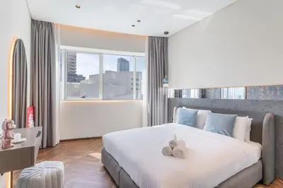 a bedroom with a large bed with two stuffed animals on it at Fully Furnished 4 BR in Dubai Marina - Very close to Metro in Dubai