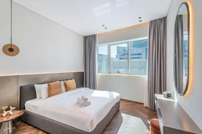 a bedroom with a bed and a large window at Fully Furnished 4 BR in Dubai Marina - Very close to Metro in Dubai