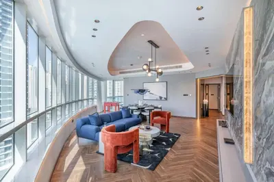 a living room with a blue couch and chairs at Fully Furnished 4 BR in Dubai Marina - Very close to Metro in Dubai