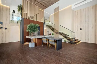 a lobby with a staircase and a table and chairs at Luxury Duplex - 2 BR - Dubai Marina JBR in Dubai