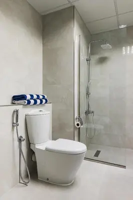 a bathroom with a toilet and a shower at JBR Full Sea View Apartment 1 BR in Dubai