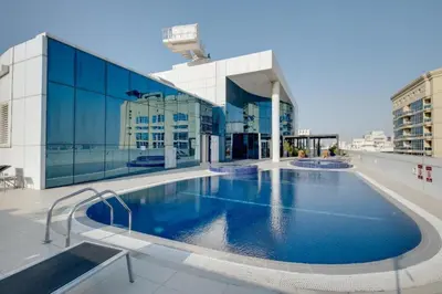 a large swimming pool on the roof of a building at Stylish and Sleek - Studio - JLT in Dubai