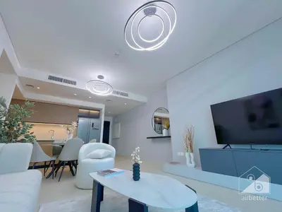 a living room with a couch and a table at Burj Crown Luxury 2-Bedroom with Balcony in Dubai