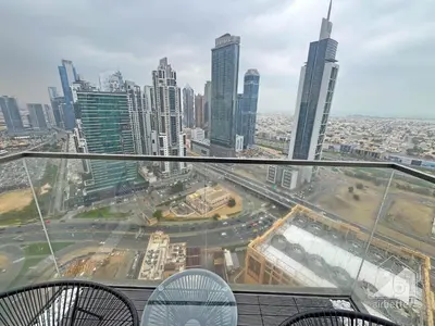 a view of a city from the top of a skyscraper at 2BR in Burj Crown l Pool Access & City Views in Dubai