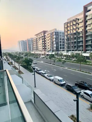 a view of a city with cars parked on a street at Dubai Galaxy in Azizi Riviera Luxury Studio in Dubai