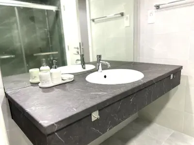 a bathroom counter with a sink and a mirror at ROYAL BEACH RESIDENCES 2 in Dubai