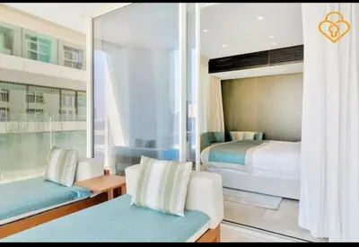 a hotel room with a bed and a couch and a bedroom at Five Palm Residences 2 Bedroom Apt in Dubai