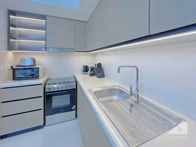 a kitchen with a sink and a stove at Burj Crown Luxury 2bedroom Balcony & View in Dubai