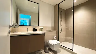 a bathroom with a toilet and a sink and a shower at Burj Crown Luxury 2bedroom Balcony & View in Dubai