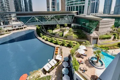 an overhead view of a swimming pool in a city at Next To Metro Unique 2bed Apt Wlarge Balcony in Dubai