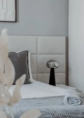 a bedroom with a bed with a headboard at Burj Crown Luxurious 2Bedroom Balcony in Dubai