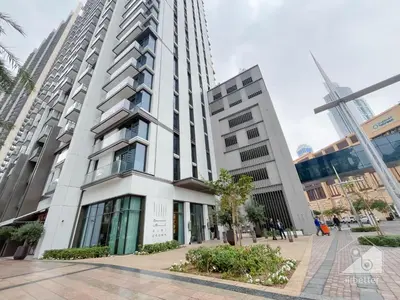 a tall white building in a city at Burj Crown Luxurious 2Bedroom Balcony in Dubai
