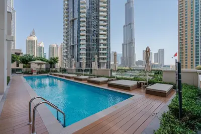 a swimming pool on the roof of a building at Brand New Luxurious 2BR ACT Towers Downtown in Dubai