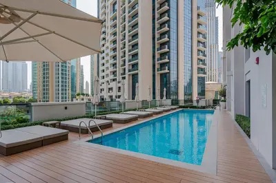 a swimming pool on the roof of a building at Brand New Luxurious 2BR ACT Towers Downtown in Dubai