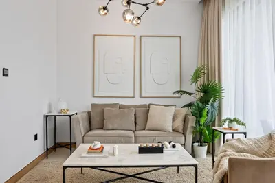 a living room with a couch and a coffee table at Hidden Gem, Waterfront Escape With Harbor View in Dubai
