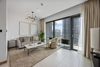 a living room with a couch and a table at Hidden Gem, Waterfront Escape With Harbor View in Dubai