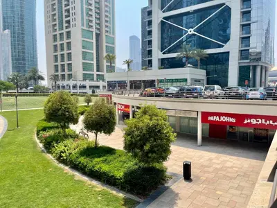 a view of a city with tall buildings at Rustic Elegance By The Lake Studio Cabin In Jlt in Dubai
