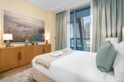 a bedroom with a large bed and a large window at Vacay Lettings 1 bed Business home in J One Tower Business bay in Dubai