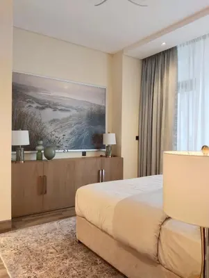 a bedroom with a bed and a painting on the wall at Vacay Lettings 1 bed Business home in J One Tower Business bay in Dubai