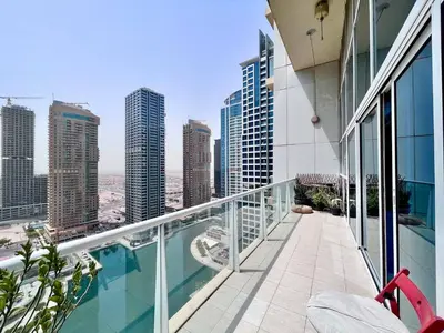 a balcony with a view of a city at Jlt Spacious Corner Duplex Loft Panoramic Views in Dubai