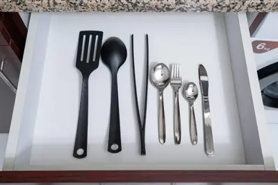 a group of silver utensils in a drawer at Newly Built Studio - Comfort in Dubai
