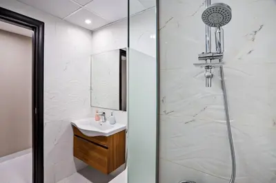 a bathroom with a shower and a sink at Newly Built Studio - Comfort in Dubai