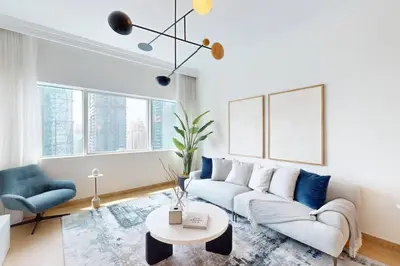 a living room with a couch and a table at MAG 218 Tower - Elegant One Bedroom in Dubai