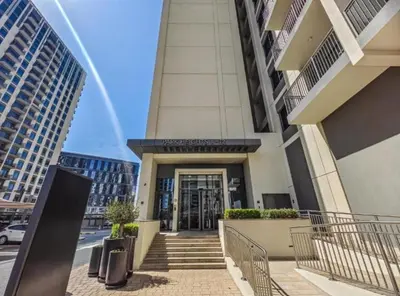 a building with a staircase leading to a building at 1BR Apartment in Park Heights 2 Dubai Hills in Dubai