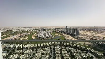 an aerial view of a city with tall buildings at EasyGo - Carson Tower C Damac Hills Studio in Dubai