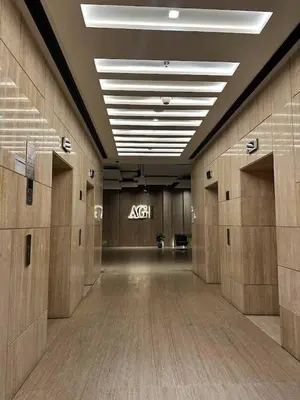 an empty hallway with an ak sign on the wall at Luxury Studio Apartment By DownTown in Dubai