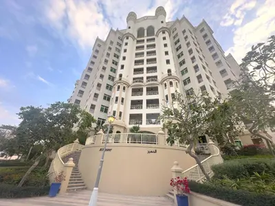 a large white building with stairs in front of it at Shoreline 7, Palm Jumeirah - Mint Stay in Dubai