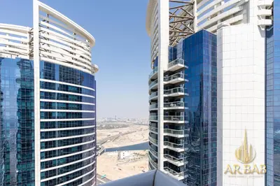 a view of two tall buildings in a city at Damac Paramount - Luxurious 2BR - Stunning Dubai Canal View - High Level in Dubai