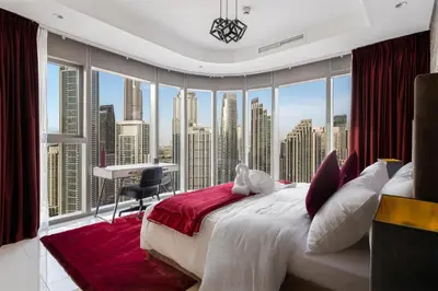 a bedroom with a large window with a view of a city at Super High Infinity Pool & Stunning Burj Khalifa View, 3-Bedroom Apartment at Paramount Hotel Midtown in Dubai