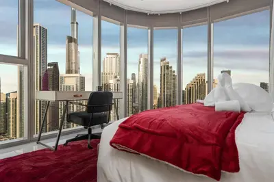 a bedroom with a view of a city skyline at Super High Infinity Pool & Stunning Burj Khalifa View, 3-Bedroom Apartment at Paramount Hotel Midtown in Dubai