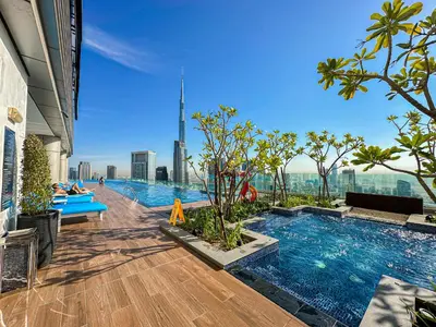 a pool on the top of a building with a view at Super High Infinity Pool & Stunning Burj Khalifa View, 3-Bedroom Apartment at Paramount Hotel Midtown in Dubai