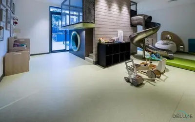 a room with a slide in the middle at Lovely 2BR at Belgravia Square, JVC by Deluxe Holiday Homes in Dubai